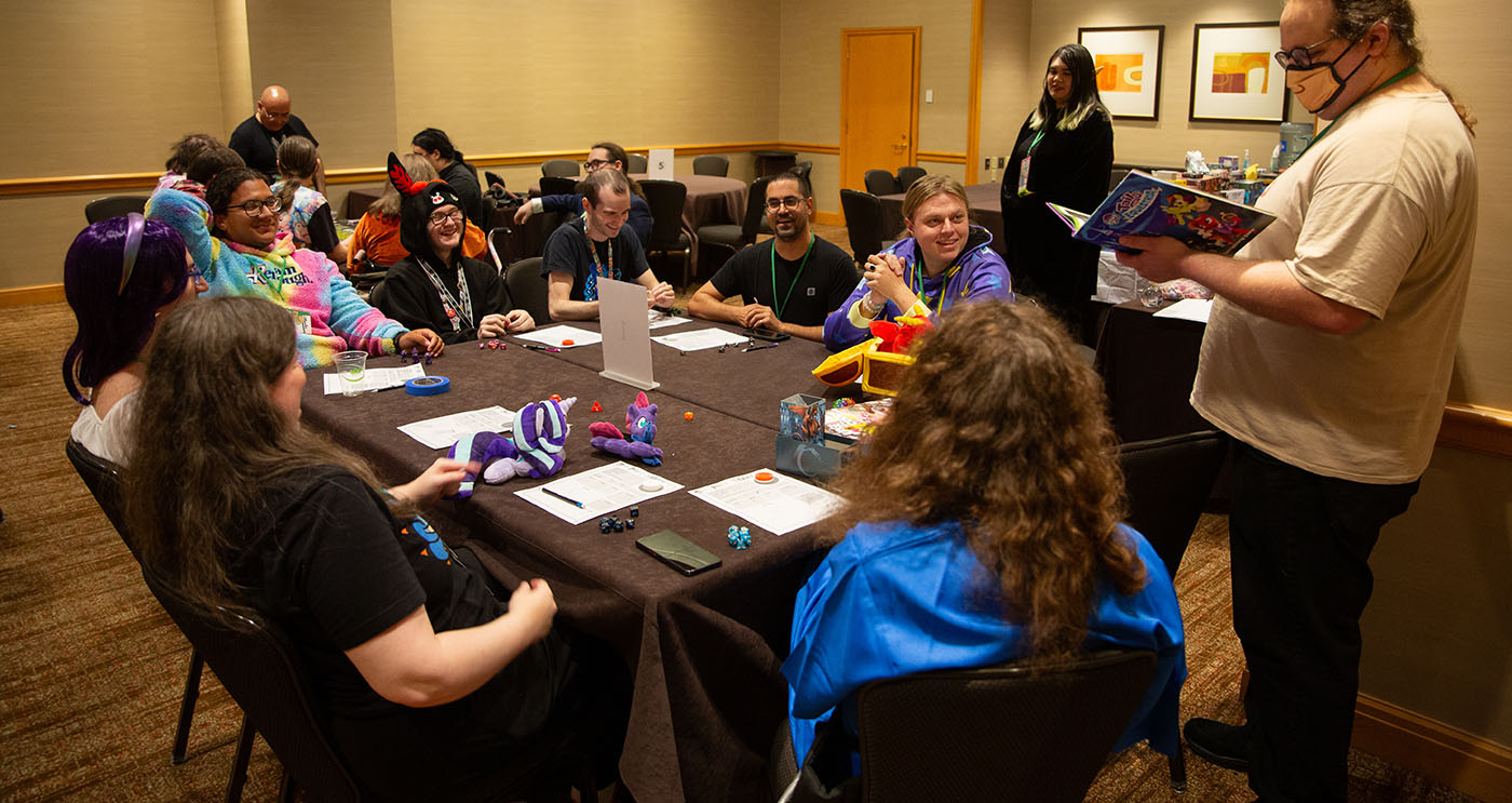 A group of attendees playing a tabletop game.