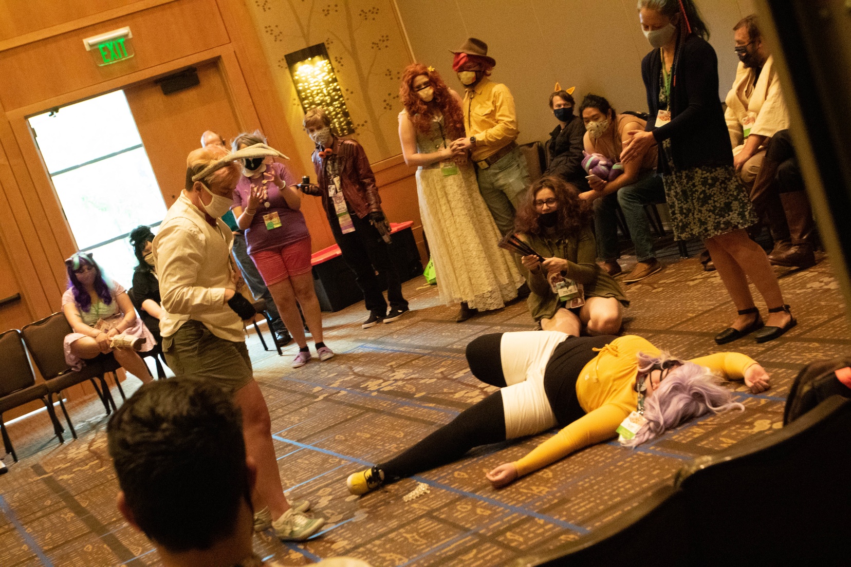 Two cosplayers acting out a battle