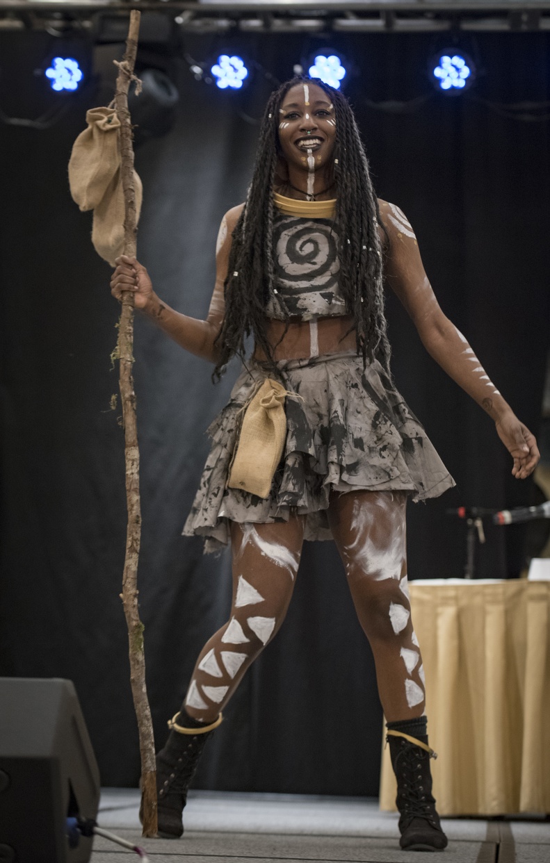A woman cosplaying as the My Little Pony character Zacora is posing on stage at the cosplay contest.